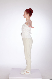 Yeva beige lace up top beige pants casual dressed standing…